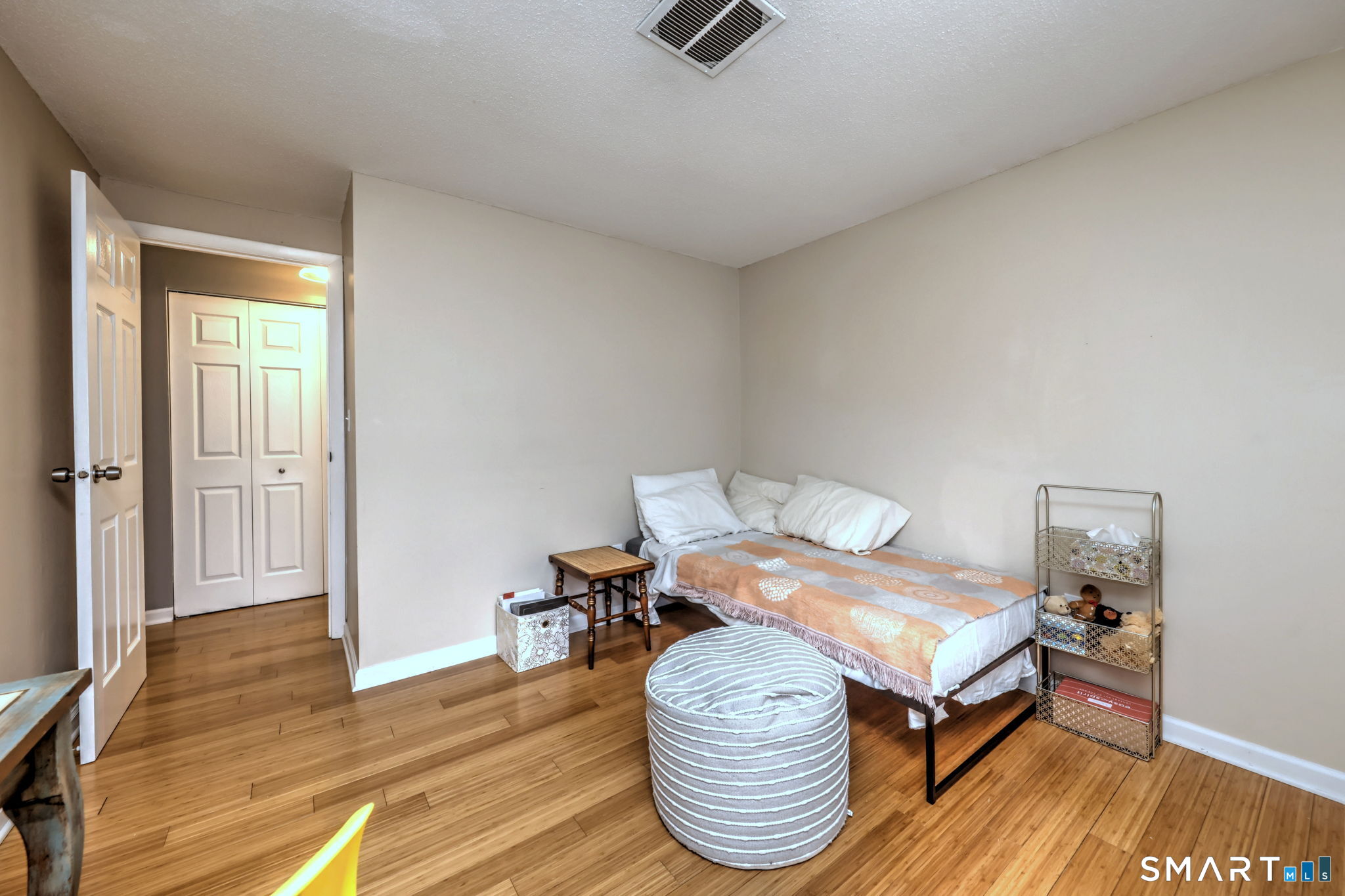 55 Dowd Avenue, Unit 22 Canton, CT 06019 - Photo 15 of 29 a bedroom with furniture and a wooden floor