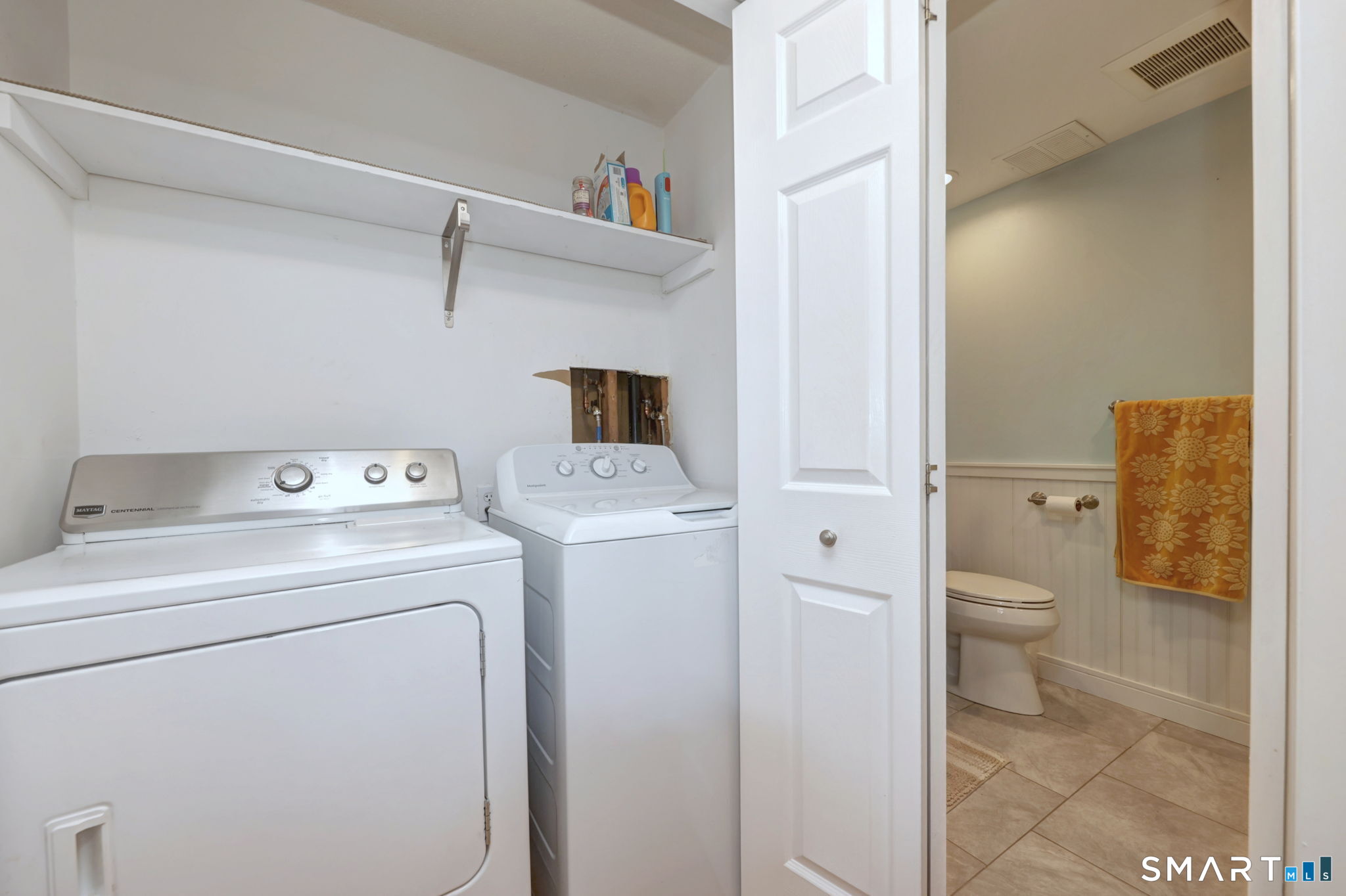 55 Dowd Avenue, Unit 22 Canton, CT 06019 - Photo 16 of 29 a view of bathroom with a washer and dryer