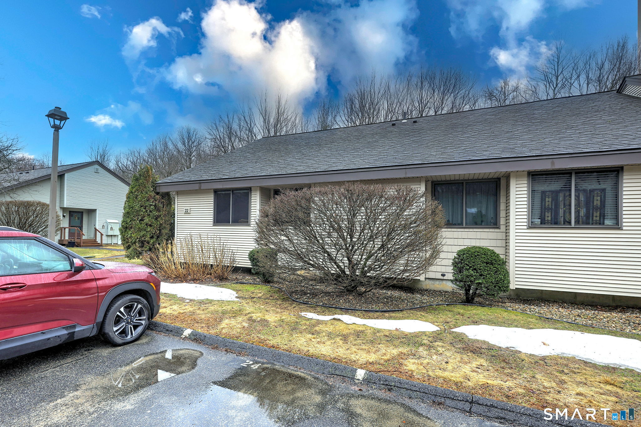 55 Dowd Avenue, Unit 22 Canton, CT 06019 - Photo 24 of 29 a front view of a house with a yard