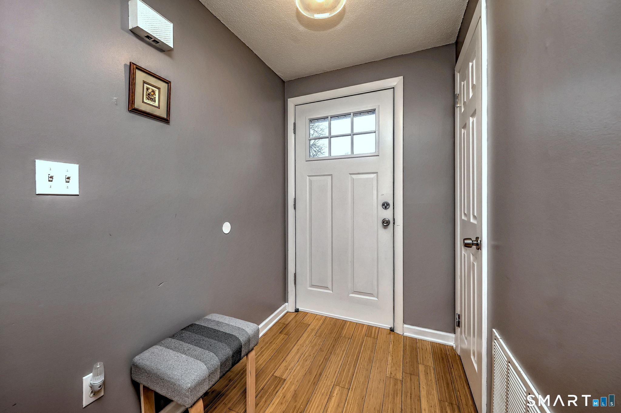 55 Dowd Avenue, Unit 22 Canton, CT 06019 - Photo 3 of 29 a view of room with window and wooden floor