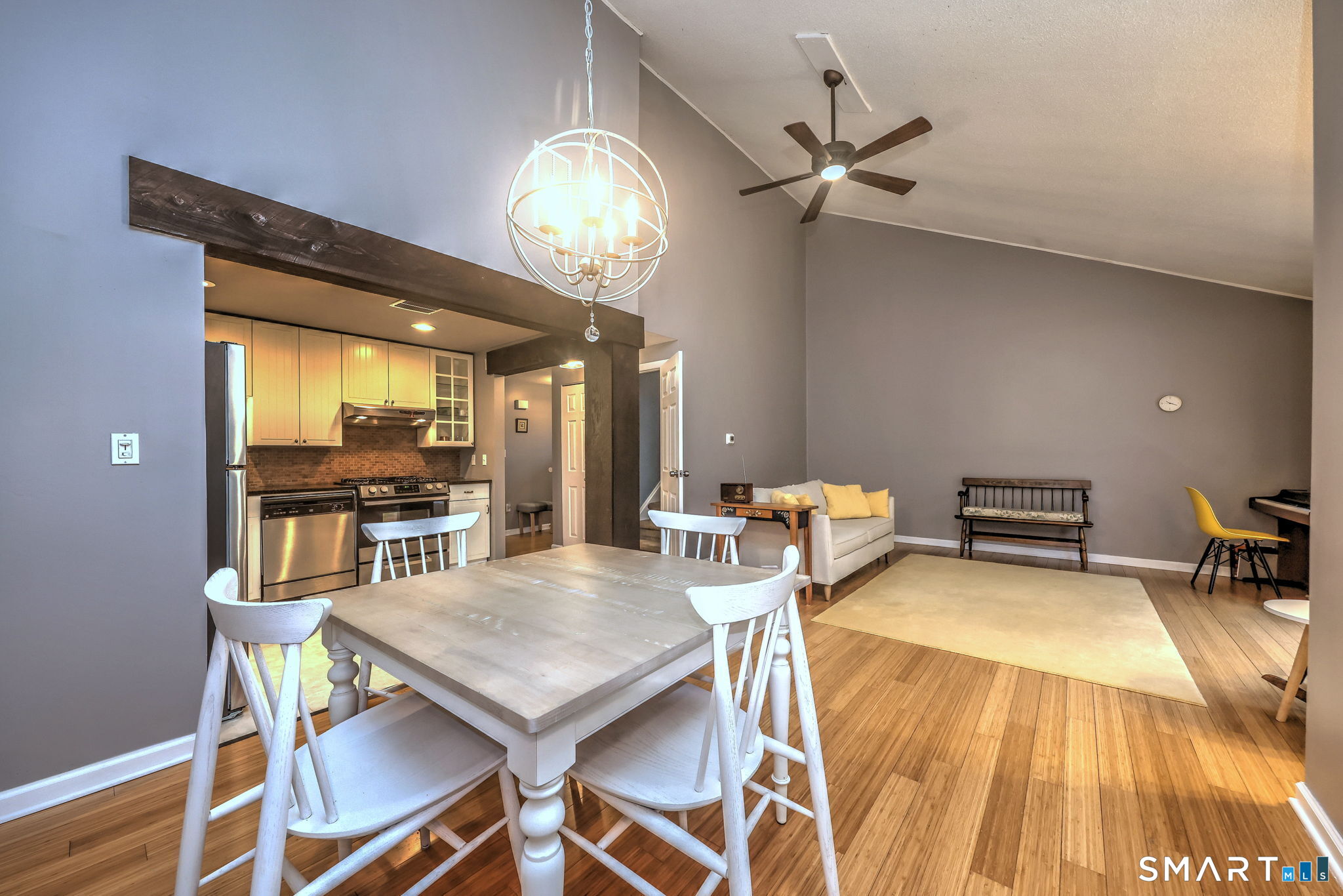 55 Dowd Avenue, Unit 22 Canton, CT 06019 - Photo 7 of 29 a view of a dining room with furniture and a chandelier