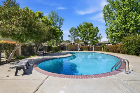 a view of a swimming pool with a patio