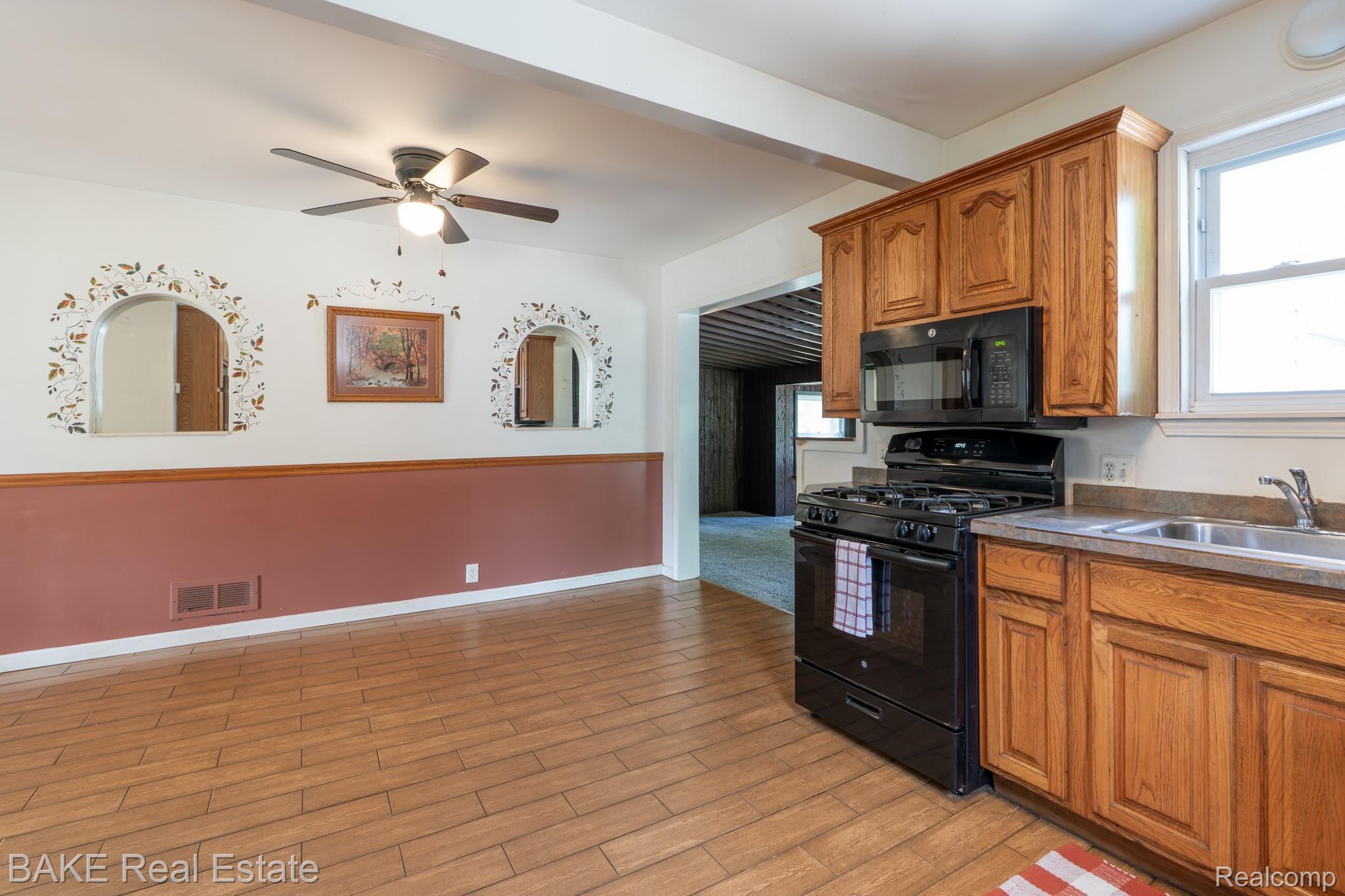 10195 Stark Road Livonia, MI 48150 - Photo 20 of 43 Oak Cabinets & Vinyl Windows with Tile Floors