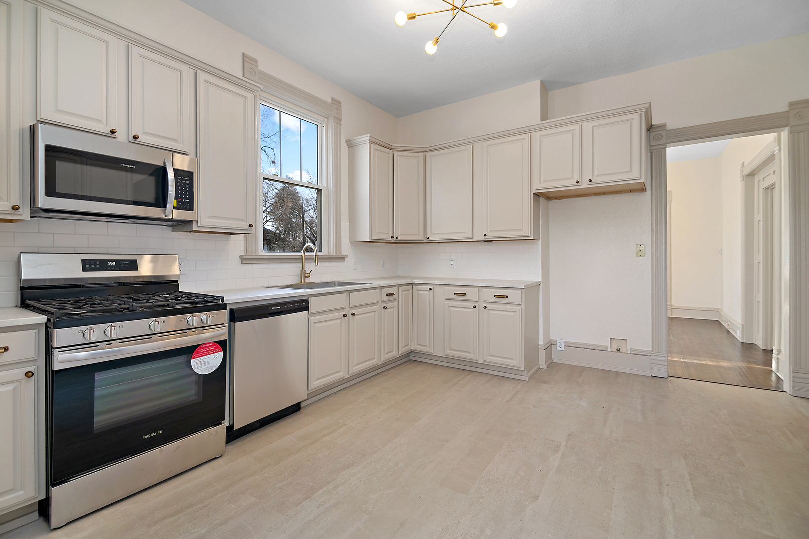 505 South Indiana Avenue Kankakee, IL 60901 - Photo 12 of 32 a kitchen with stainless steel appliances granite countertop a stove a sink and a microwave