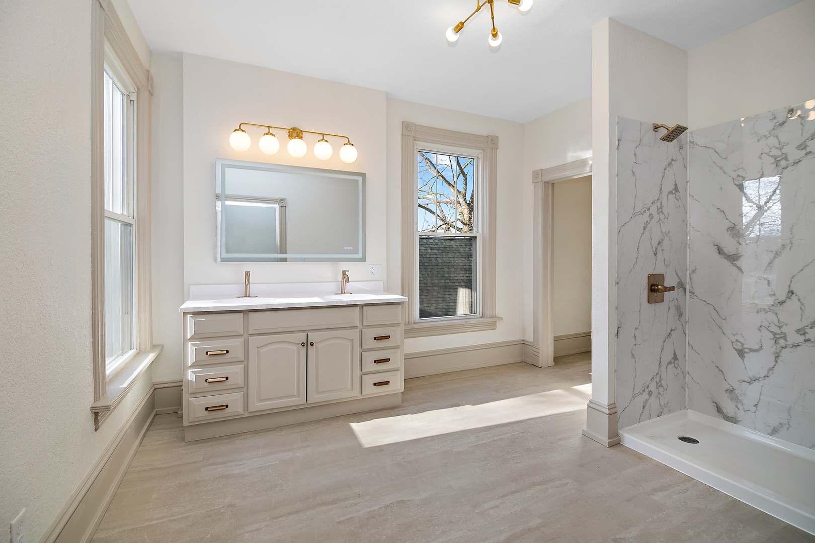 505 South Indiana Avenue Kankakee, IL 60901 - Photo 15 of 32 a spacious bathroom with a shower a sink and a mirror