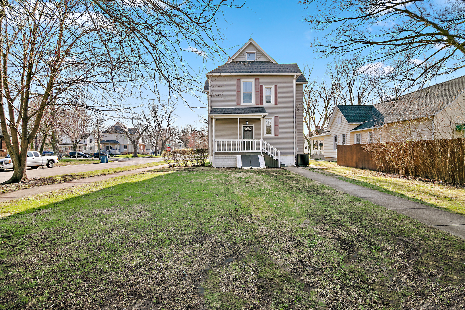 505 South Indiana Avenue Kankakee, IL 60901 - Photo 32 of 32 a view of a yard in front of a brick house with large windows