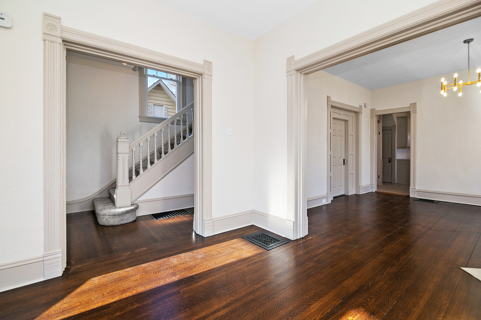 505 South Indiana Avenue Kankakee, IL 60901 - Photo 6 of 32 a view of a livingroom with wooden floor and stairs