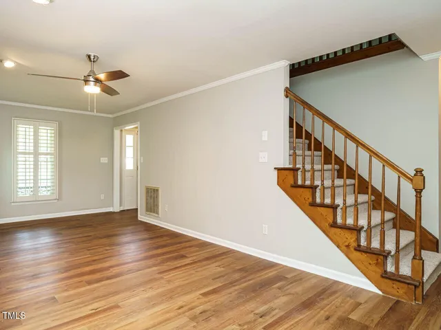 a view of an entryway with wooden floor
