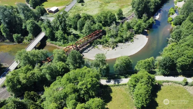 an aerial view of residential house with outdoor space and swimming pool