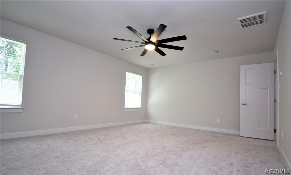 13931 Marsham Road Chester, VA 23836 - Photo 27 of 29 a view of a livingroom with a ceiling fan and window