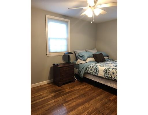 31 Ward Well Road Canton, MA 02021 - Photo 11 of 25 a bedroom with a bed and a chandelier