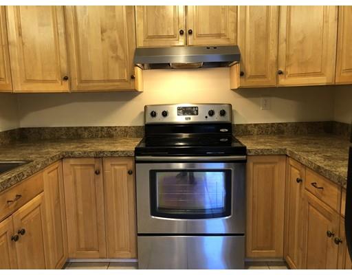 31 Ward Well Road Canton, MA 02021 - Photo 21 of 25 a kitchen with stainless steel appliances granite countertop a stove and a microwave