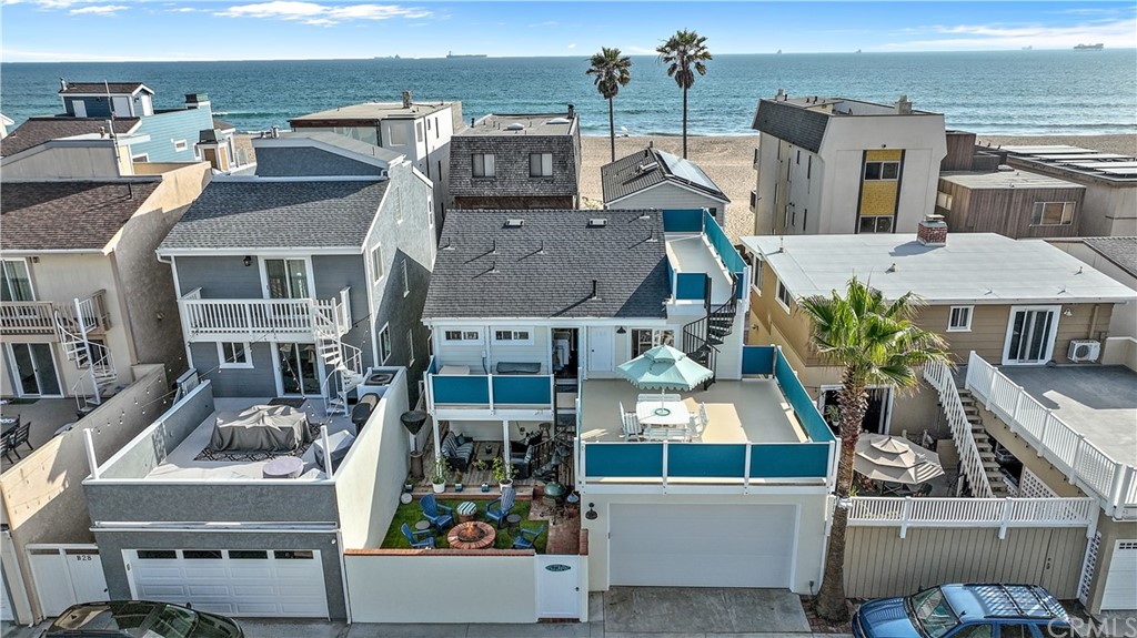 a front view of residential houses with outdoor space and parking