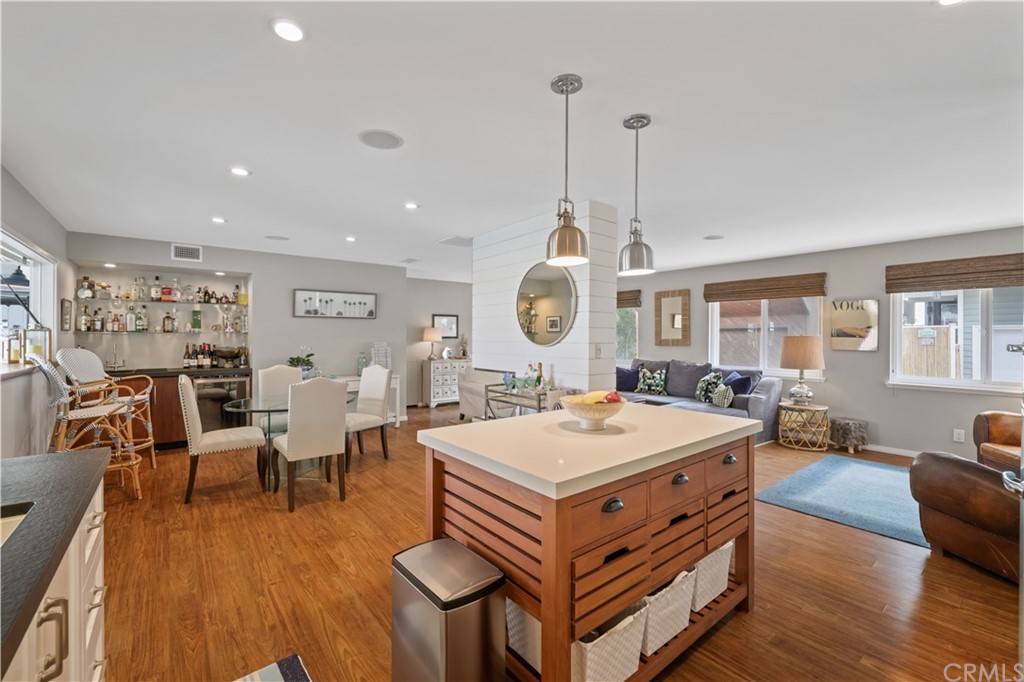 C-29 Surfside Avenue Surfside, CA 90743 - Photo 11 of 36 a view of a dining room with furniture window and wooden floor