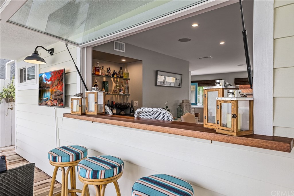 C-29 Surfside Avenue Surfside, CA 90743 - Photo 18 of 36 a bedroom with furniture and a chandelier