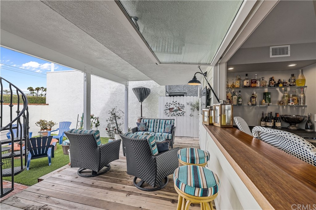 C-29 Surfside Avenue Surfside, CA 90743 - Photo 20 of 36 a view of a dining room with furniture window and wooden floor