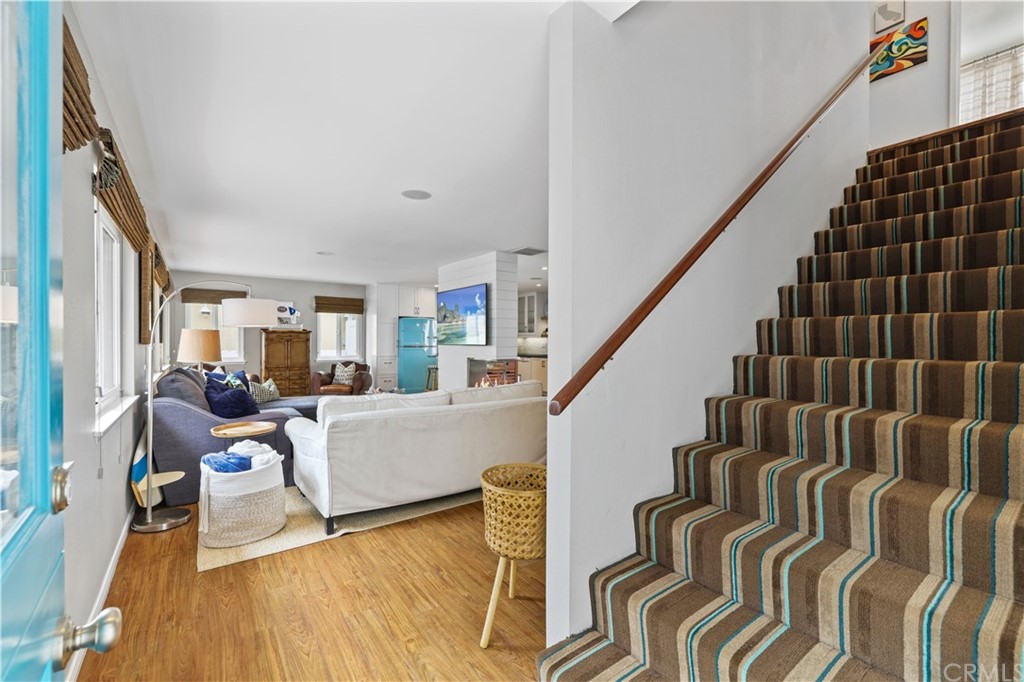 C-29 Surfside Avenue Surfside, CA 90743 - Photo 22 of 36 a living room with furniture and stairs