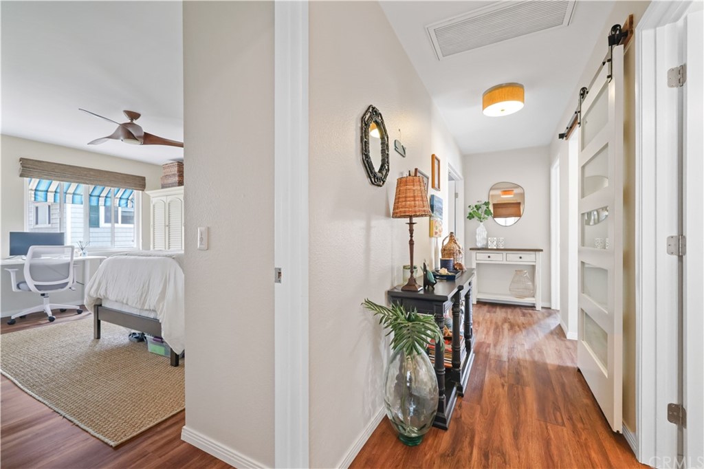 C-29 Surfside Avenue Surfside, CA 90743 - Photo 23 of 36 a very nice looking room with wooden floor and furniture