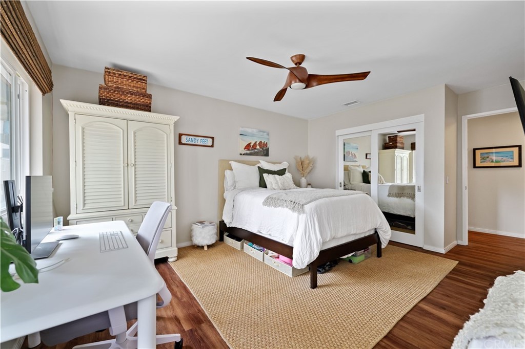 C-29 Surfside Avenue Surfside, CA 90743 - Photo 24 of 36 a bedroom with a bed and wooden floor