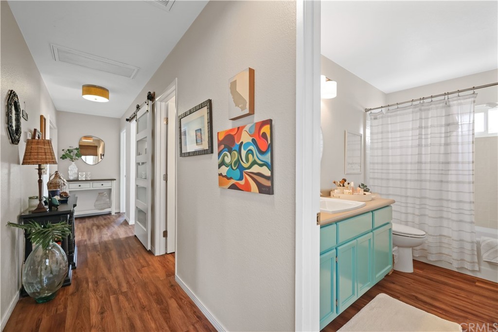 C-29 Surfside Avenue Surfside, CA 90743 - Photo 25 of 36 a room with furniture and wooden floor