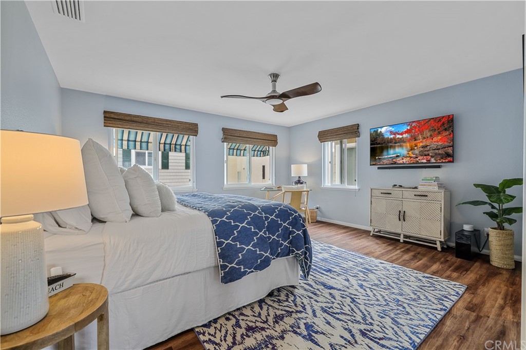 C-29 Surfside Avenue Surfside, CA 90743 - Photo 28 of 36 a spacious bedroom with a bed a window and a flat screen television