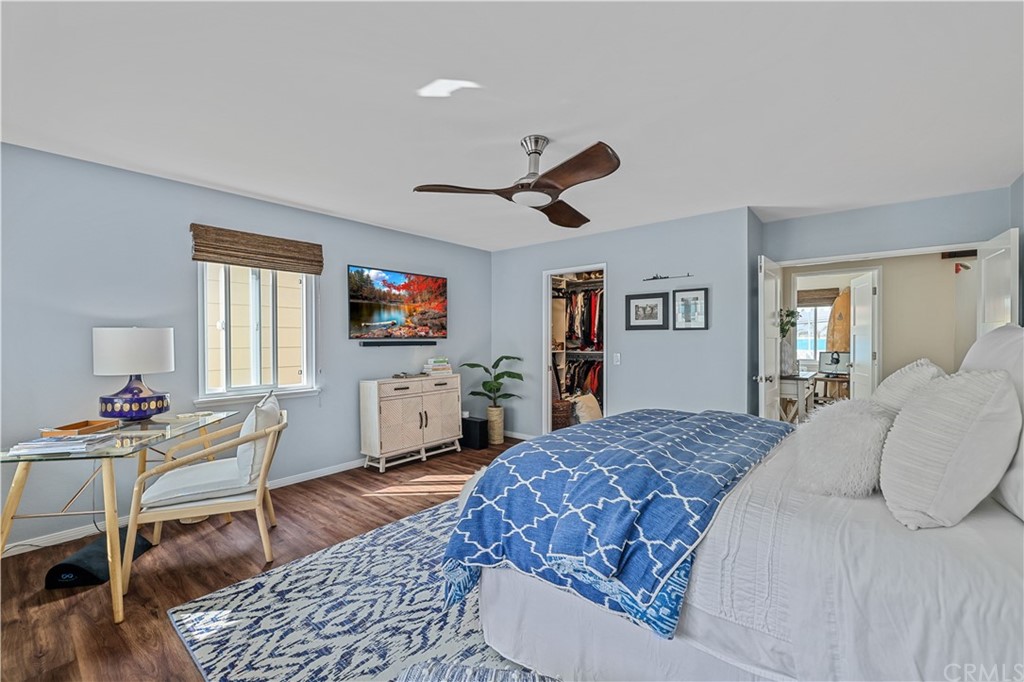 C-29 Surfside Avenue Surfside, CA 90743 - Photo 29 of 36 a living room with a bed furniture flat screen tv and a large window