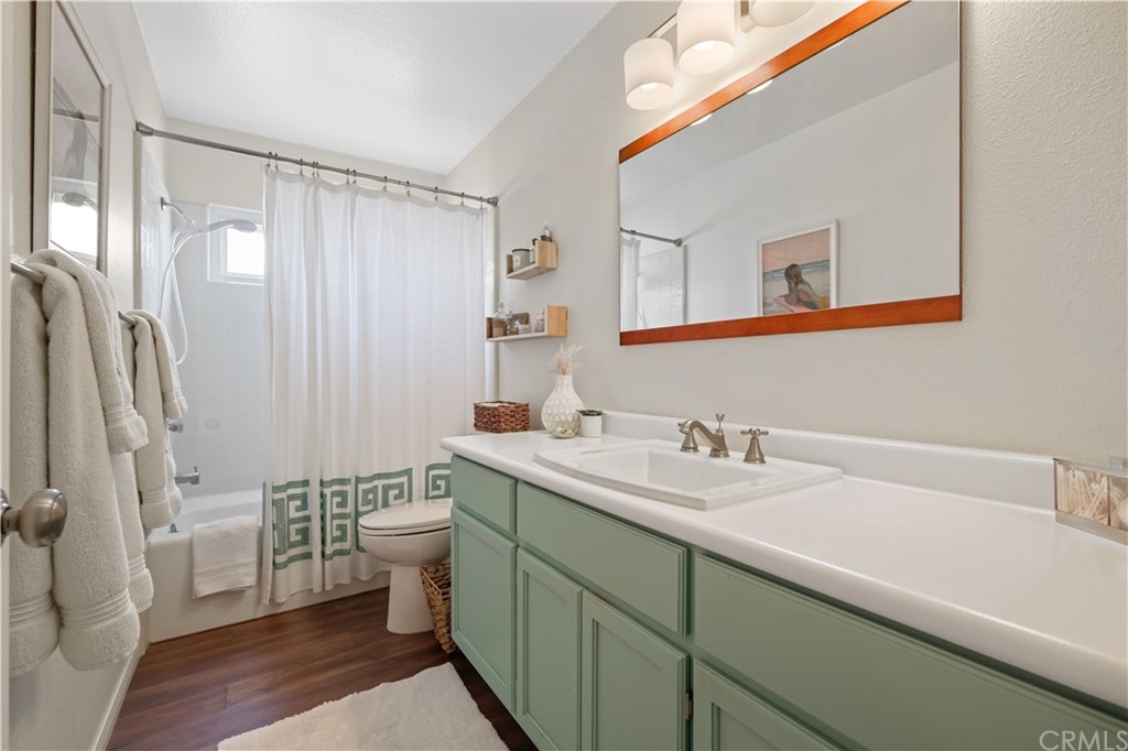 C-29 Surfside Avenue Surfside, CA 90743 - Photo 30 of 36 a bathroom with a sink a toilet and a mirror