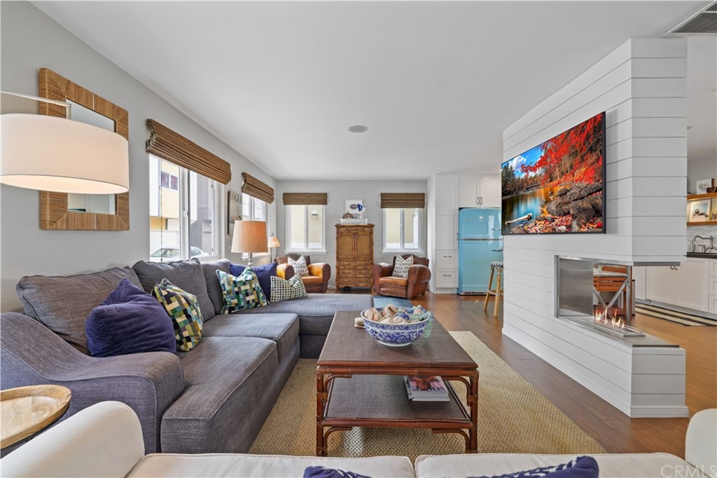 C-29 Surfside Avenue Surfside, CA 90743 - Photo 8 of 36 a living room with furniture and a flat screen tv
