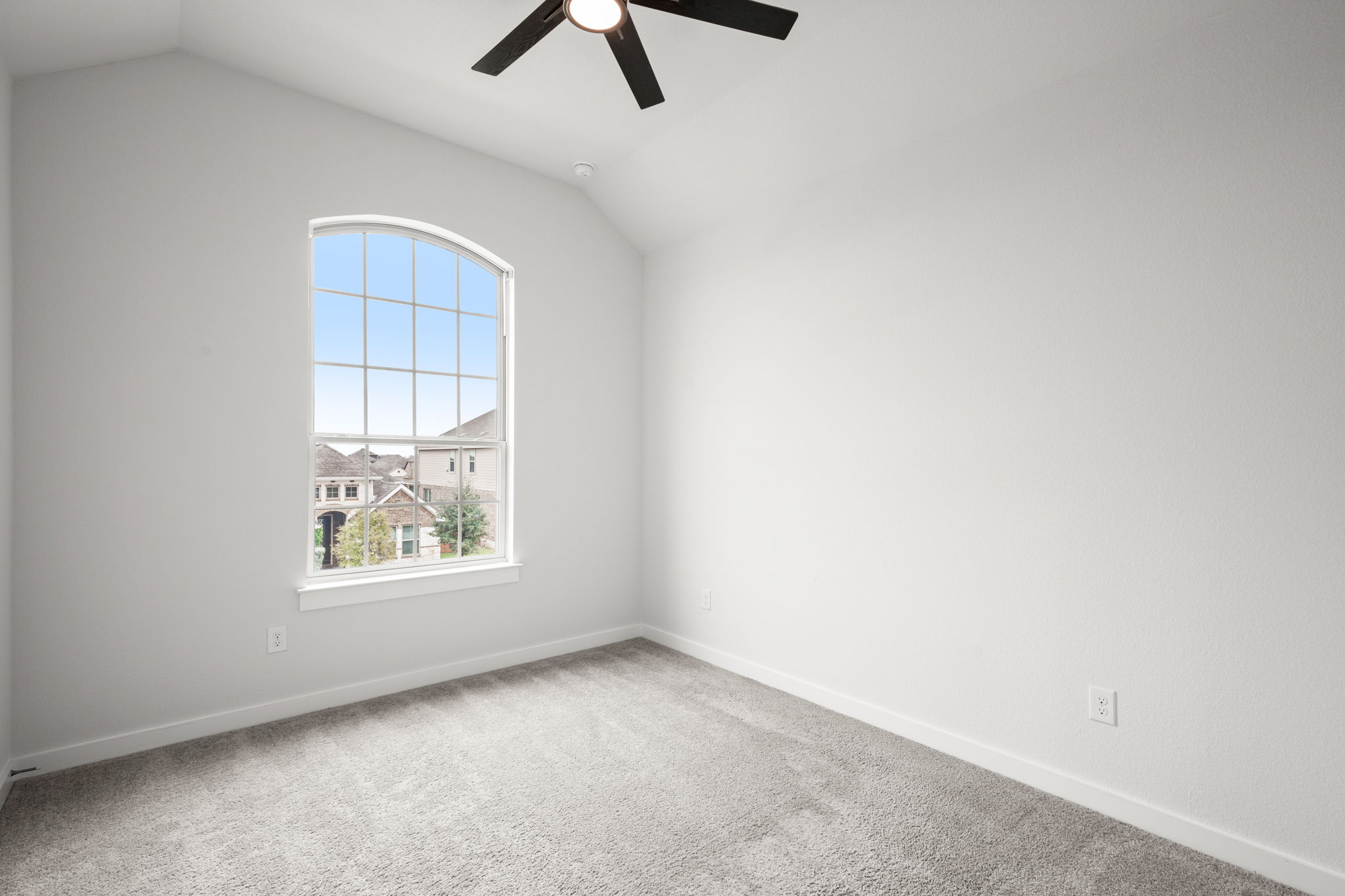 841 Spinnaker Loop Kyle, TX 78640 - Photo 36 of 40 Unfurnished room with vaulted ceiling, carpet, and ceiling fan