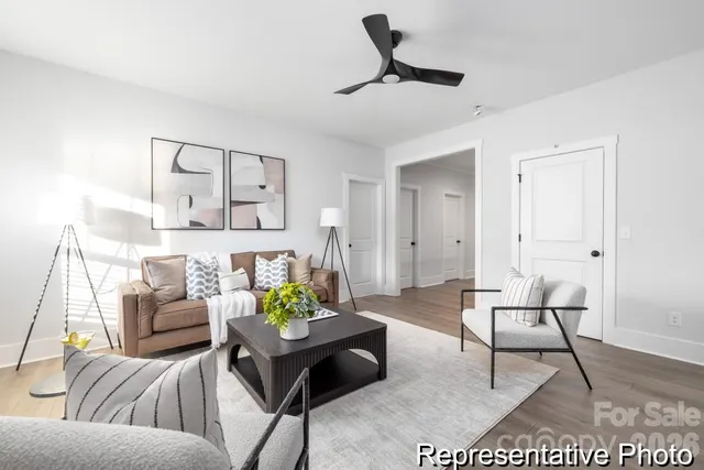 a living room with furniture and a rug