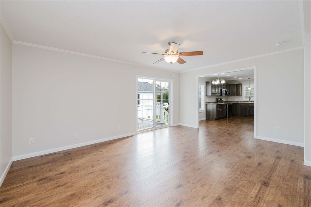 17 Maries Way Raynham, MA 02767 - Photo 14 of 39 a view of an empty room with a kitchen