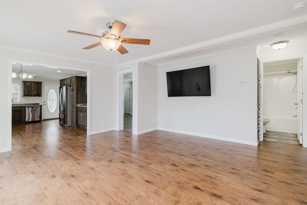 17 Maries Way Raynham, MA 02767 - Photo 16 of 39 wooden floor in an empty room with a window