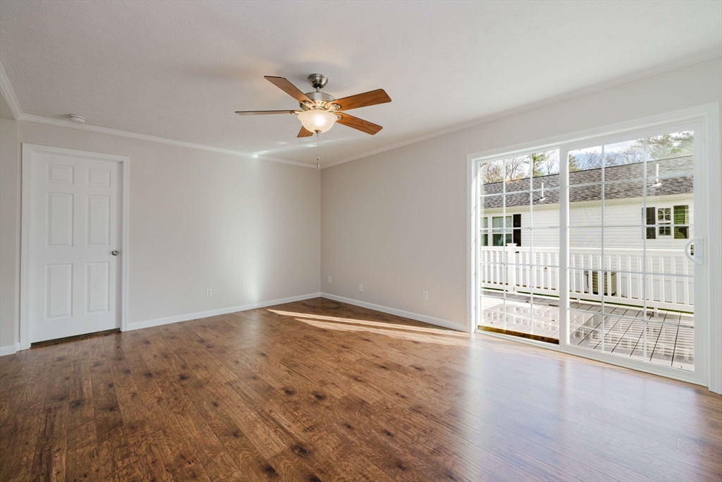 17 Maries Way Raynham, MA 02767 - Photo 17 of 39 wooden floor in an empty room with a window
