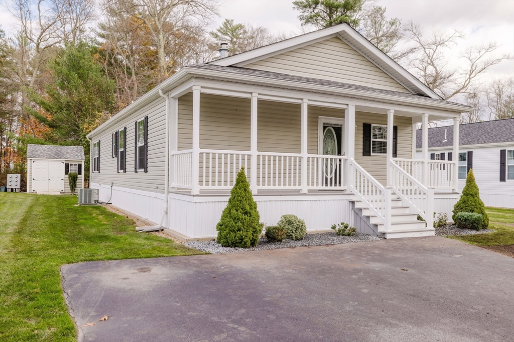 17 Maries Way Raynham, MA 02767 - Photo 2 of 39 a front view of a house with garden