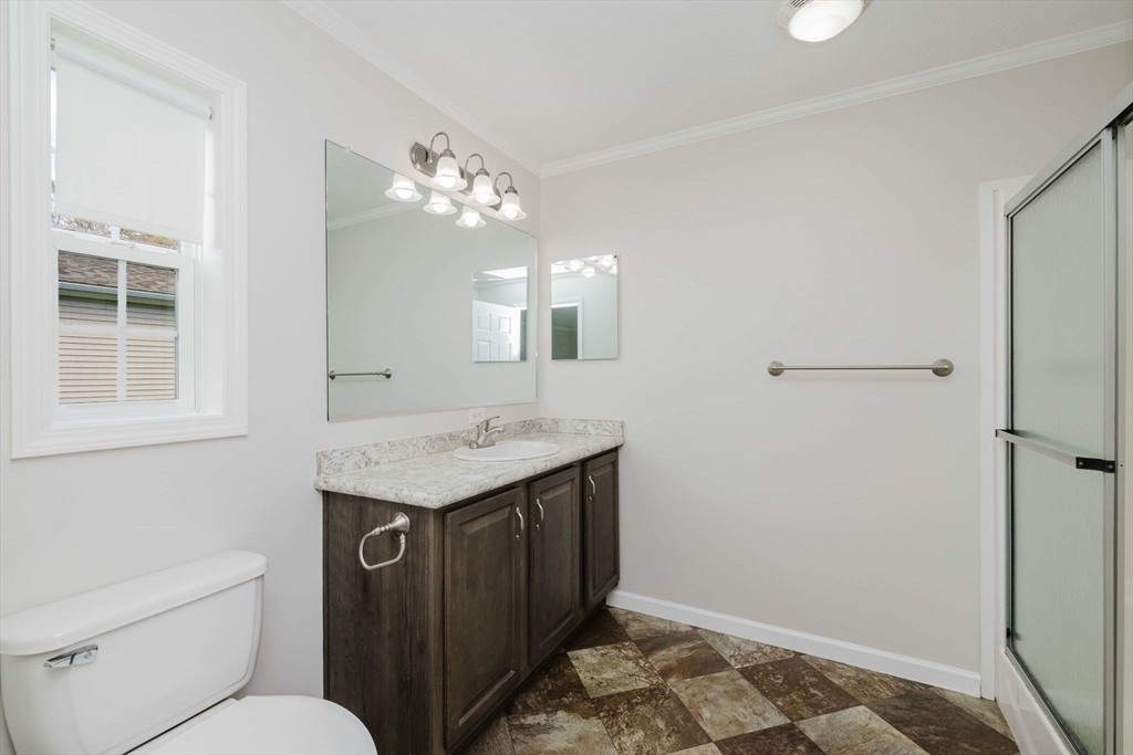 17 Maries Way Raynham, MA 02767 - Photo 25 of 39 a bathroom with a granite countertop sink and a mirror