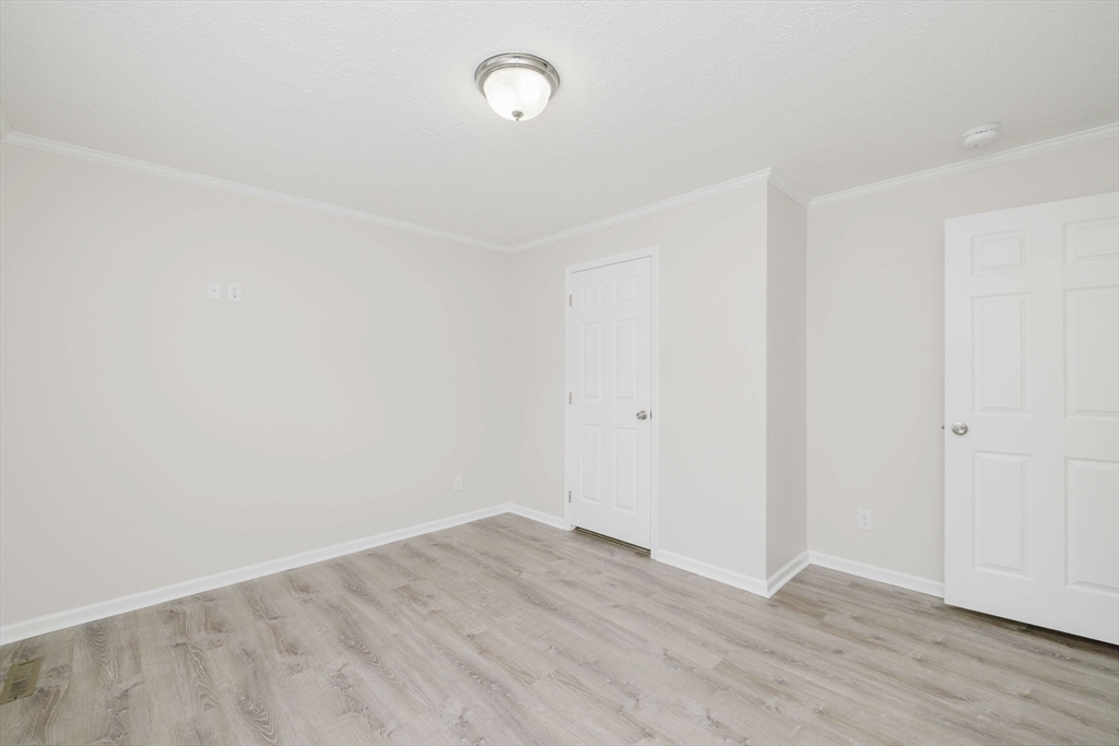 17 Maries Way Raynham, MA 02767 - Photo 28 of 39 a view of an empty room with wooden floor