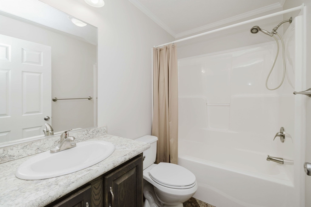 17 Maries Way Raynham, MA 02767 - Photo 29 of 39 a bathroom with a granite countertop sink toilet and shower