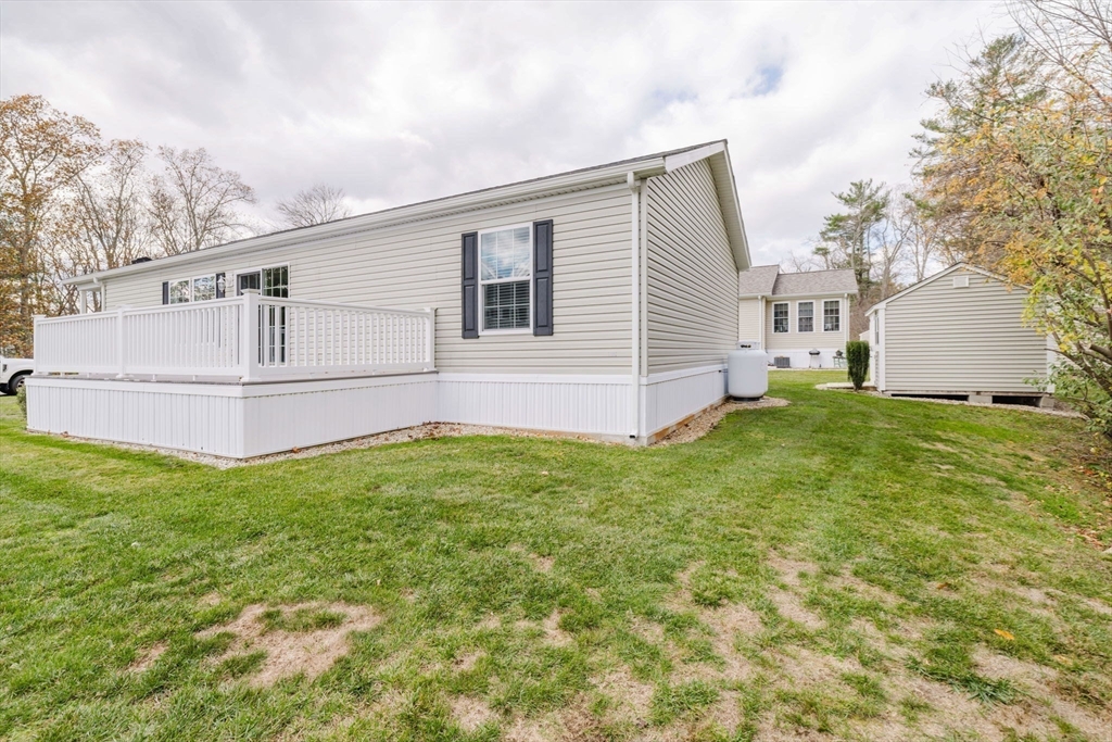 17 Maries Way Raynham, MA 02767 - Photo 35 of 39 a view of a house with a yard and fence