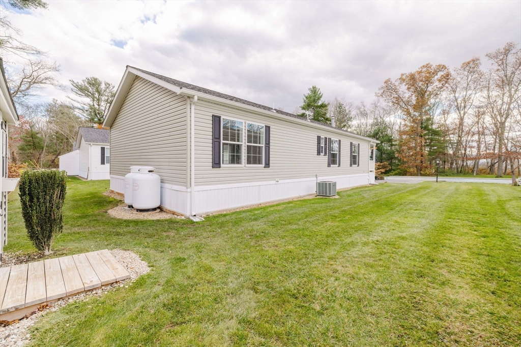 17 Maries Way Raynham, MA 02767 - Photo 36 of 39 a view of a house with backyard and sitting area