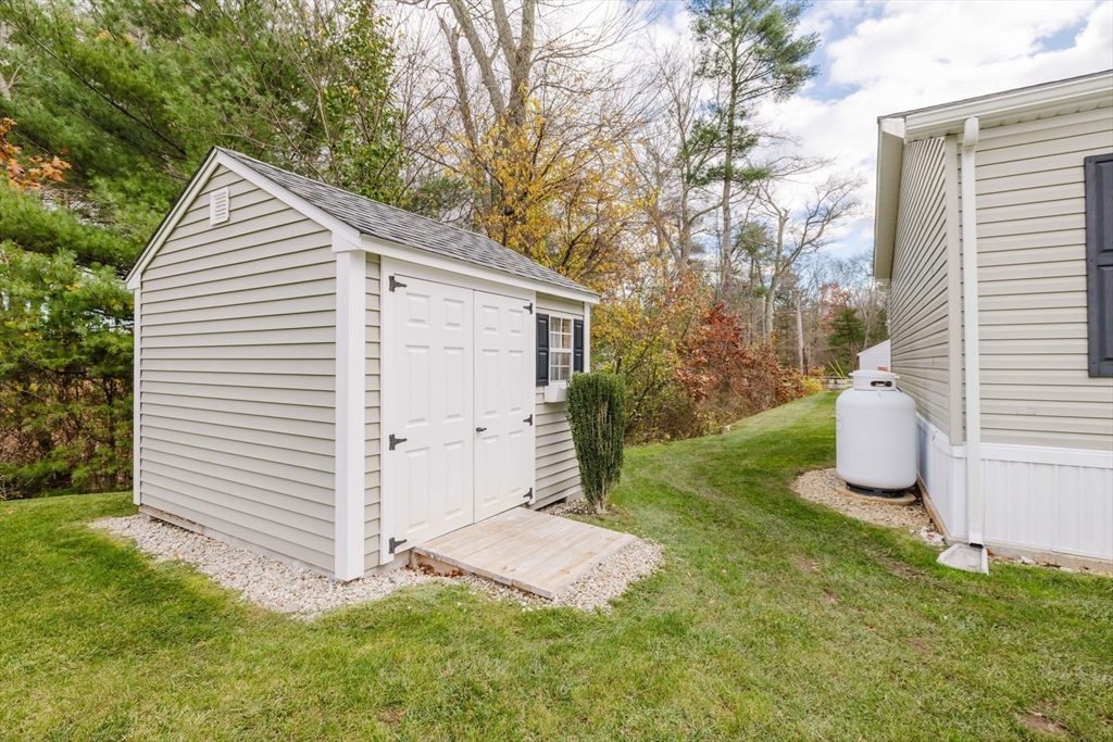 17 Maries Way Raynham, MA 02767 - Photo 37 of 39 a view of a house with a yard and garage