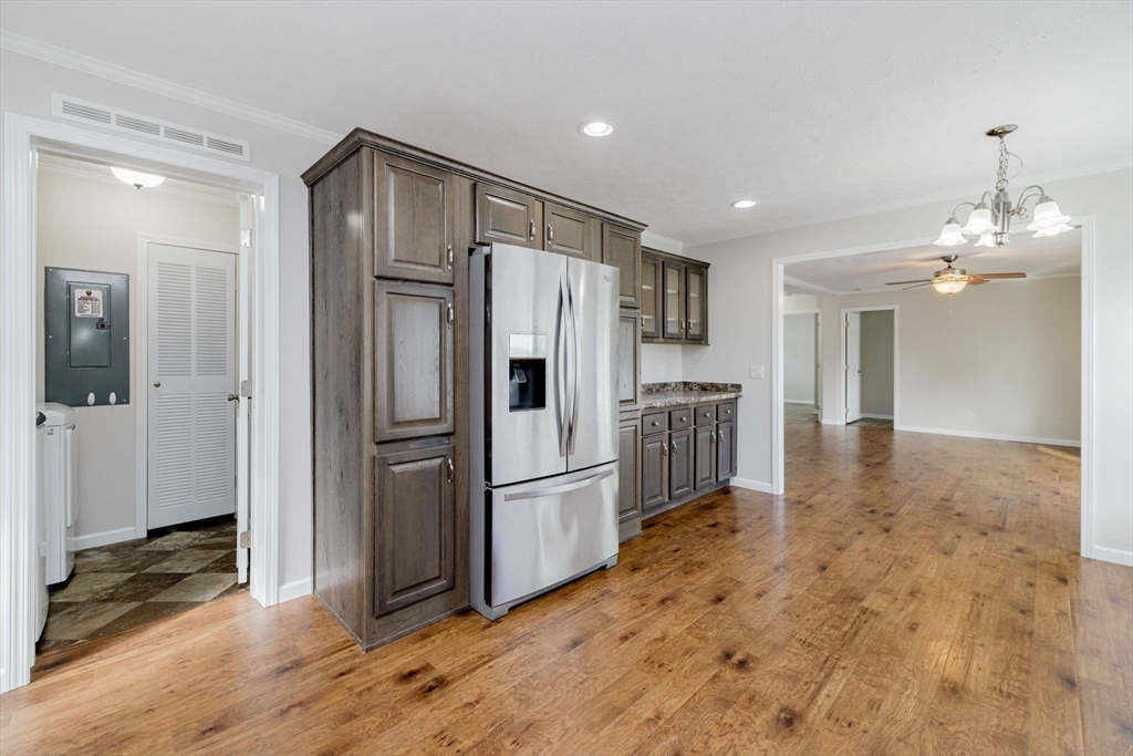 17 Maries Way Raynham, MA 02767 - Photo 10 of 39 a kitchen with granite countertop a refrigerator and a sink