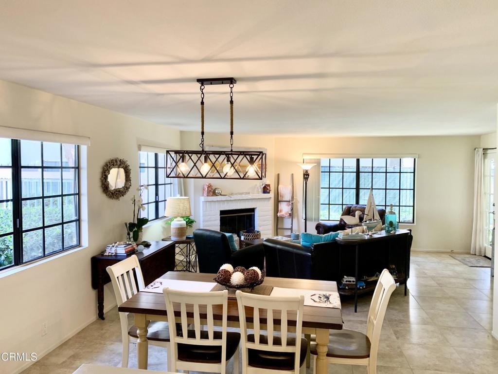 754 Island View Circle Port Hueneme, CA 93041 - Photo 12 of 67 a dining room with furniture a chandelier and wooden floor