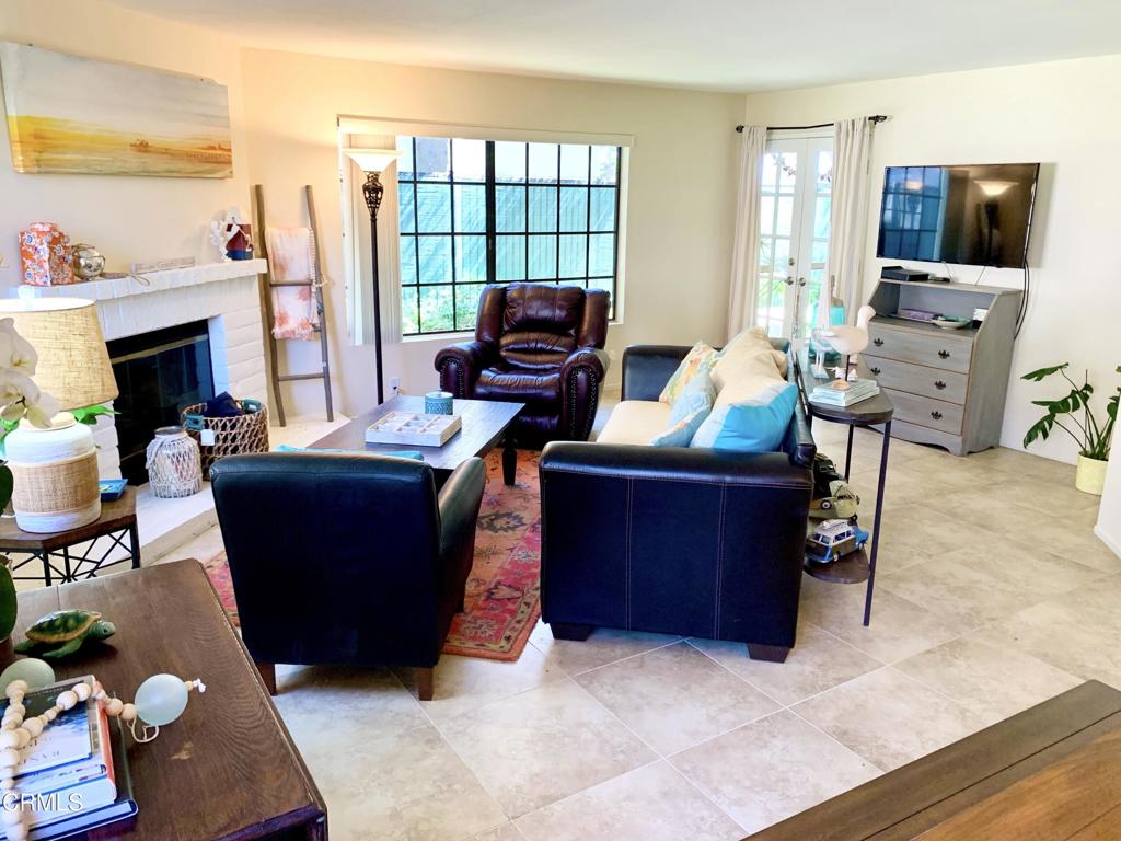 754 Island View Circle Port Hueneme, CA 93041 - Photo 14 of 67 a living room with furniture a flat screen tv and a fireplace