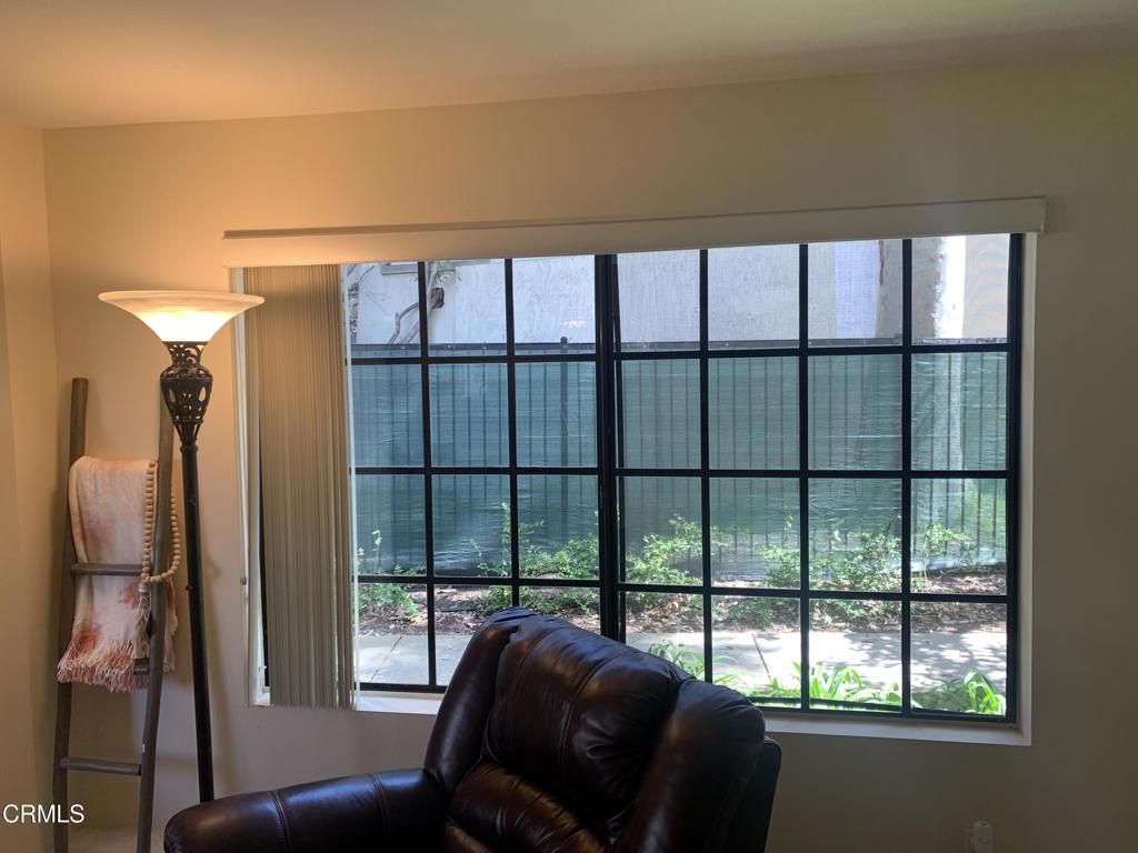 754 Island View Circle Port Hueneme, CA 93041 - Photo 15 of 67 a living room with furniture and a floor to ceiling window