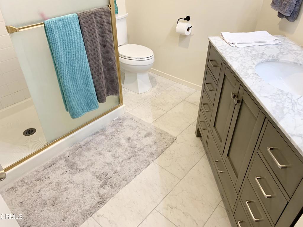754 Island View Circle Port Hueneme, CA 93041 - Photo 27 of 67 a bathroom with a granite countertop sink and a toilet