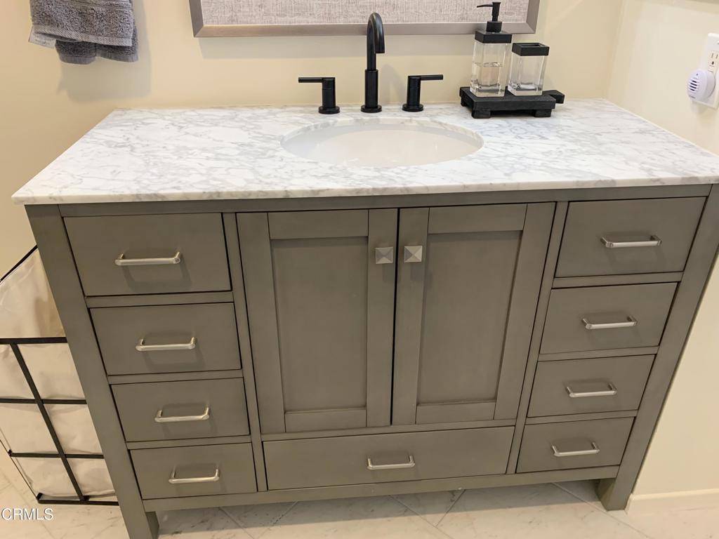 754 Island View Circle Port Hueneme, CA 93041 - Photo 28 of 67 a bathroom with a granite countertop vanity and mirror