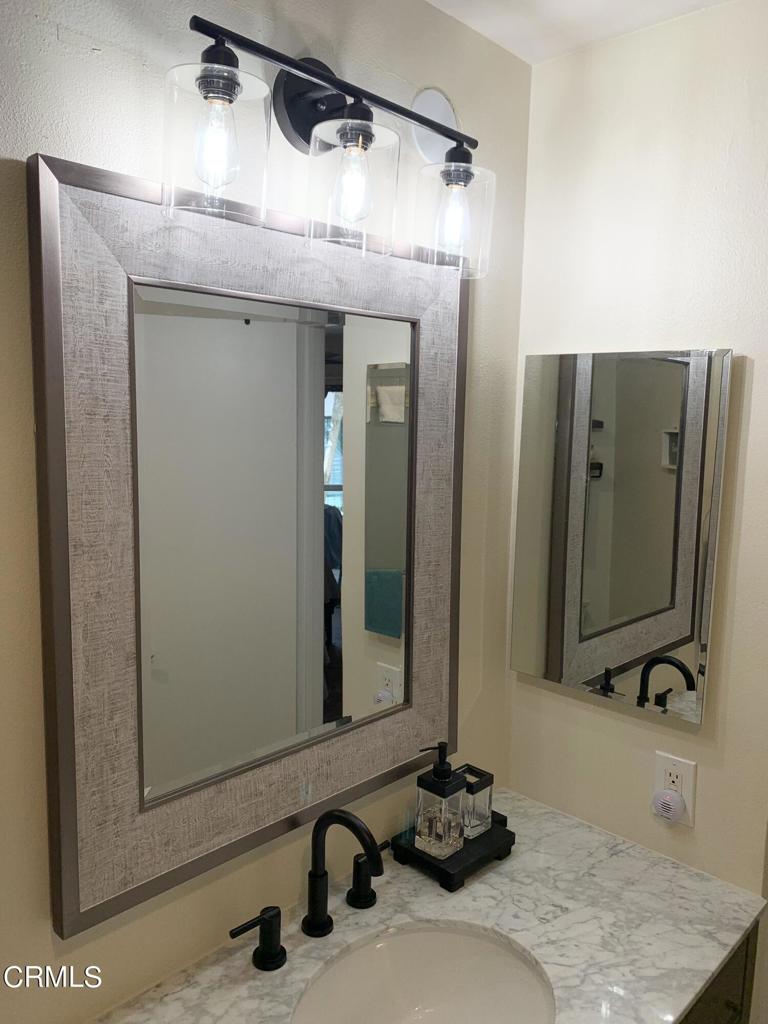 754 Island View Circle Port Hueneme, CA 93041 - Photo 29 of 67 a bathroom with a sink and a mirror