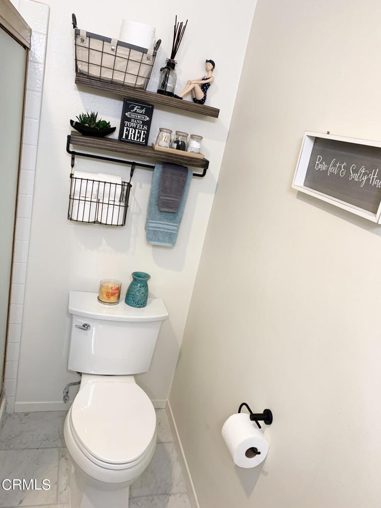 754 Island View Circle Port Hueneme, CA 93041 - Photo 30 of 67 a bathroom with a toilet a sink and mirror