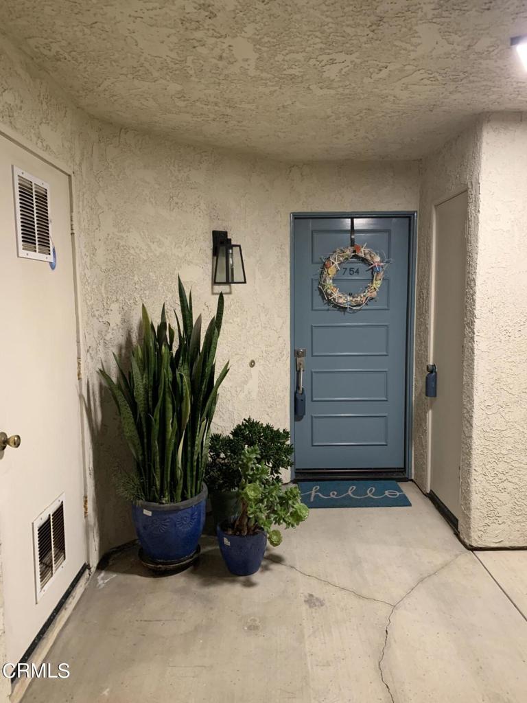 754 Island View Circle Port Hueneme, CA 93041 - Photo 43 of 67 a potted plant sitting in front of a house