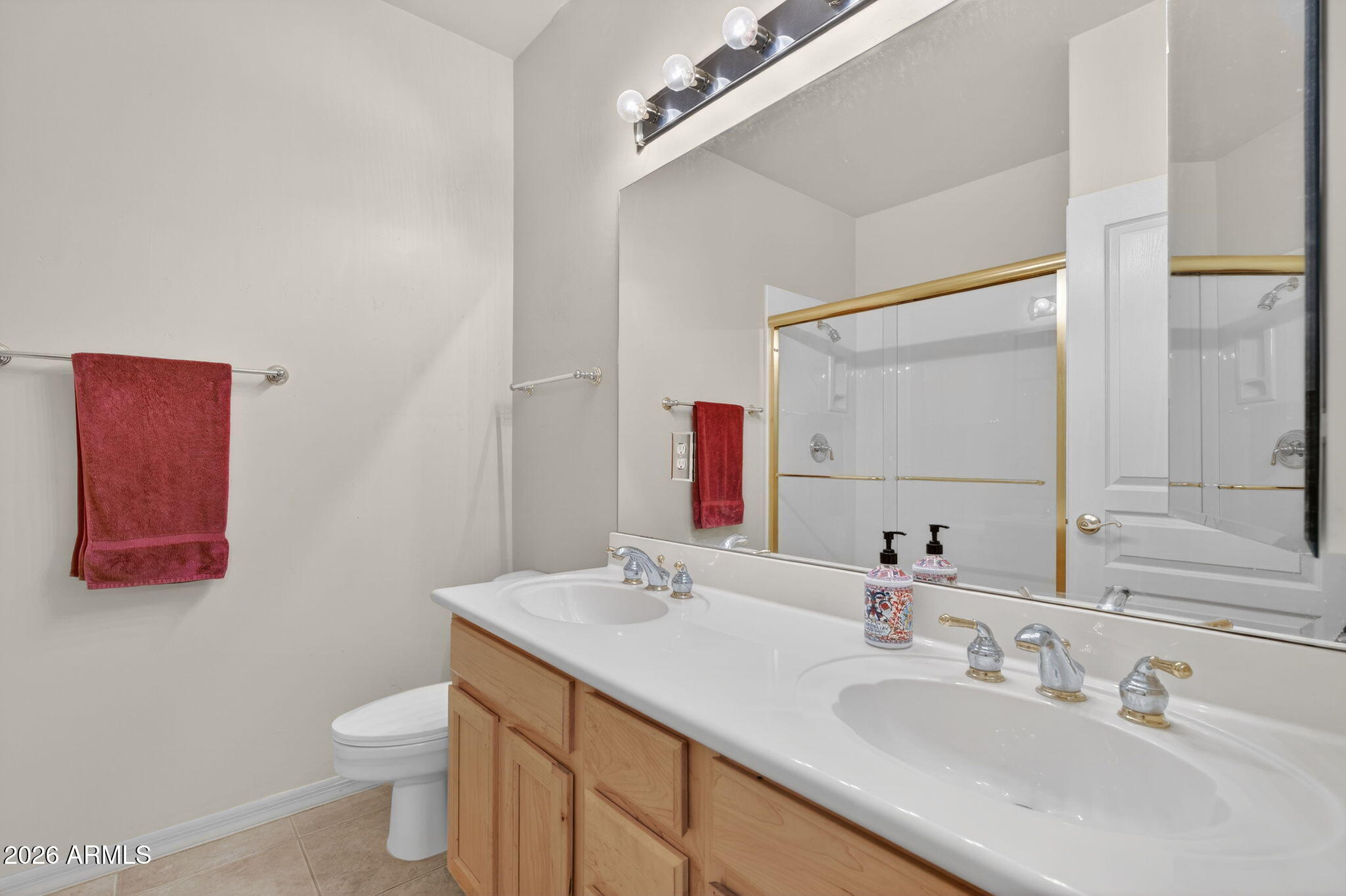 4055 North Recker Road, Unit 18 Mesa, AZ 85215 - Photo 24 of 63 a bathroom with a sink vanity mirror and toilet